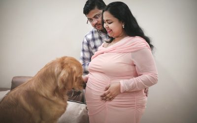 a woman and a man with a dog